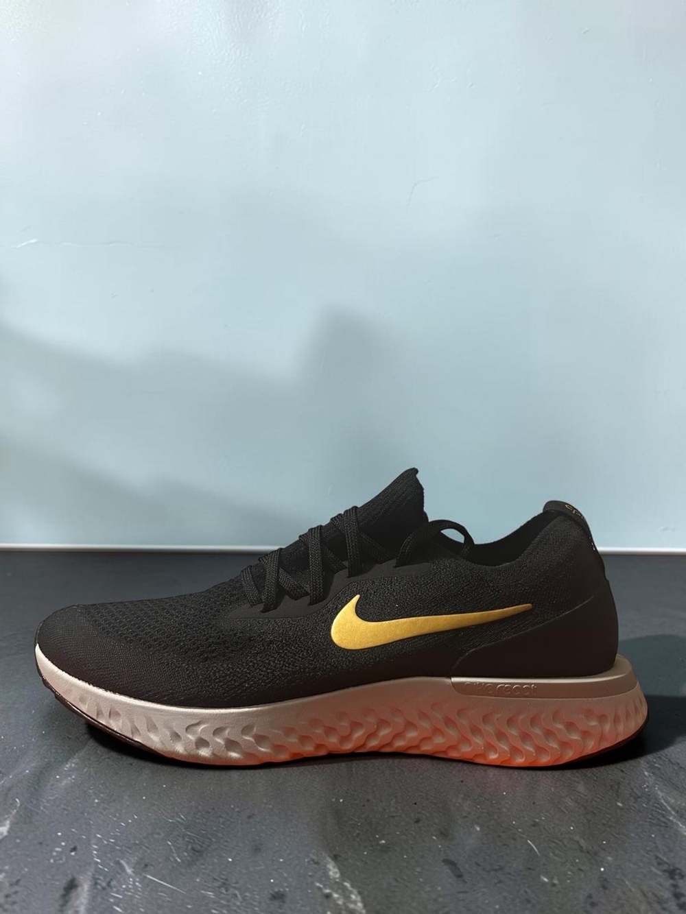 Nike Black and Gold Women’s Running Sneaker